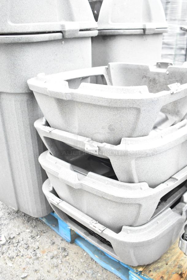 Two gray poly trash cans with seven matching lids stacked on a pallet, showcasing durable construction. Suitable for varied waste management needs.