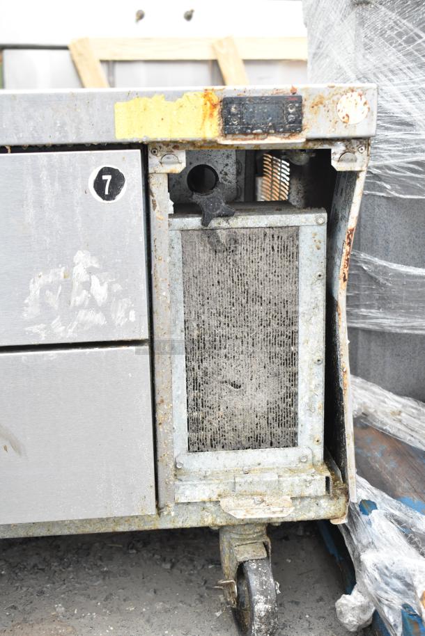 Delfield 2 Drawer Chef Base on Commercial Casters. Shows signs of rust and wear. Operates on 115 volts, 1 phase.