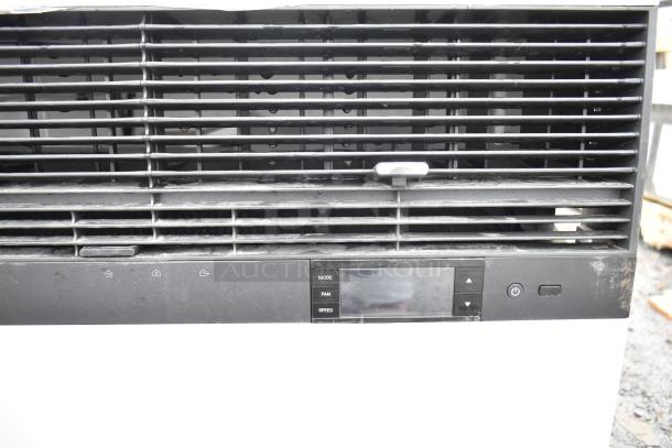 Friedrich air conditioner, 120/208 volts, 1 phase, black front panel with control buttons, used condition.