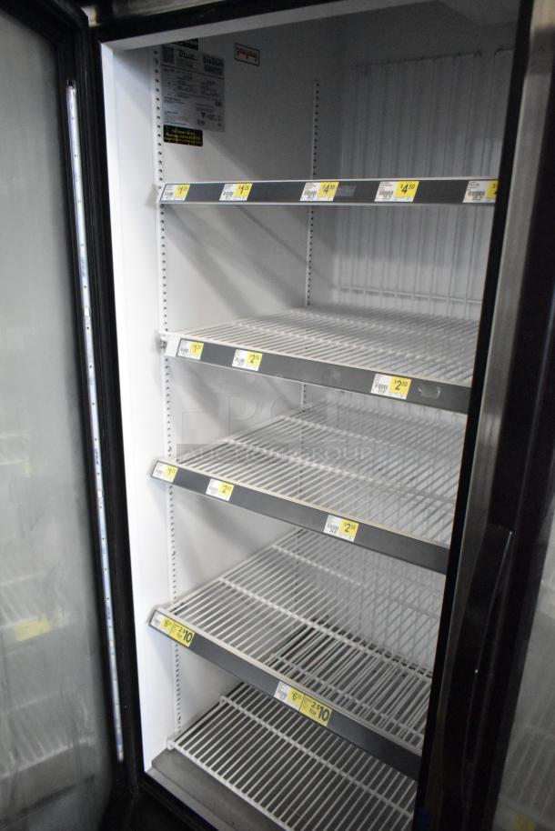 2018 True GDM-72F-HC Commercial 3-Door Reach-In Freezer with shelves, 115/208-230V, labels visible, good condition.