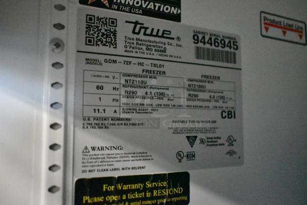 Label on 2018 True GDM-72F-HC commercial freezer showing model info, voltage, refrigerant type R290, and compressor details.