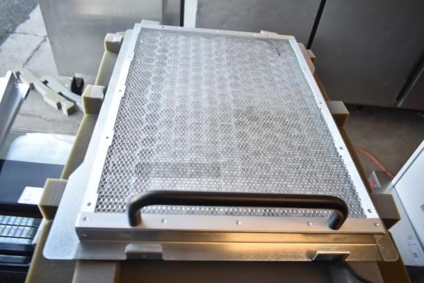 BRAND NEW De Shaw 12-00123-01-MOD_A00 unit in metallic casing, honeycomb panel, minor scratches, with protective foam packaging.