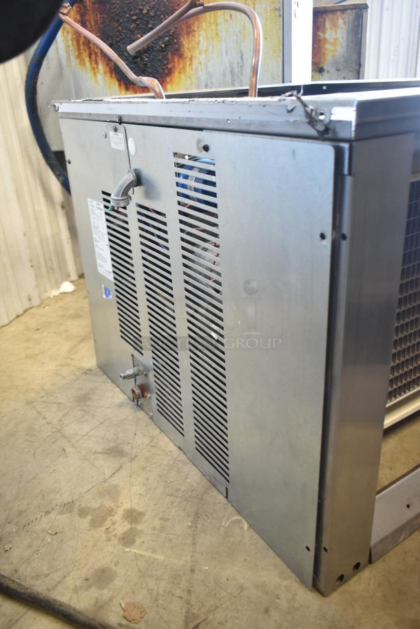 2021 Ice-O-Matic ICE1506HT2 Commercial Ice Head, side view. 208-230V, 1 Phase. Metal housing, good condition.