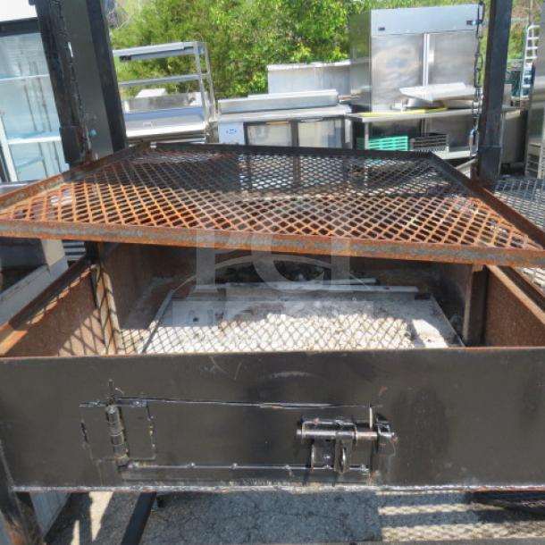 One UNIQUE BBQ/Frying outdoor cooking appliance with grill area, dual deep fryer, covered roof, on casters, 109x34x83.