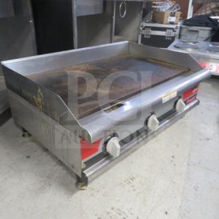APW Wyott EG-36H electric griddle, 36x25x16 inches, countertop model, with control knobs, visibly used condition.