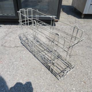 Metal can rack, holds one 10lb can. Dimensions 8x25x15 inches. Used condition, suitable for pantry or kitchen storage.