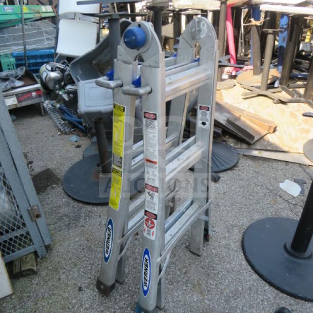 Werner ladder, 300lb max capacity, aluminum construction. Features safety labels and Werner branding. Used condition.