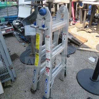 Werner ladder, 300lb max capacity, aluminum construction. Features safety labels and Werner branding. Used condition.