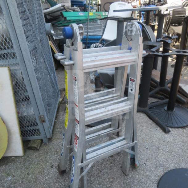 Werner ladder with 300lb max capacity, sturdy aluminum construction, visible safety labels, and compact storage.