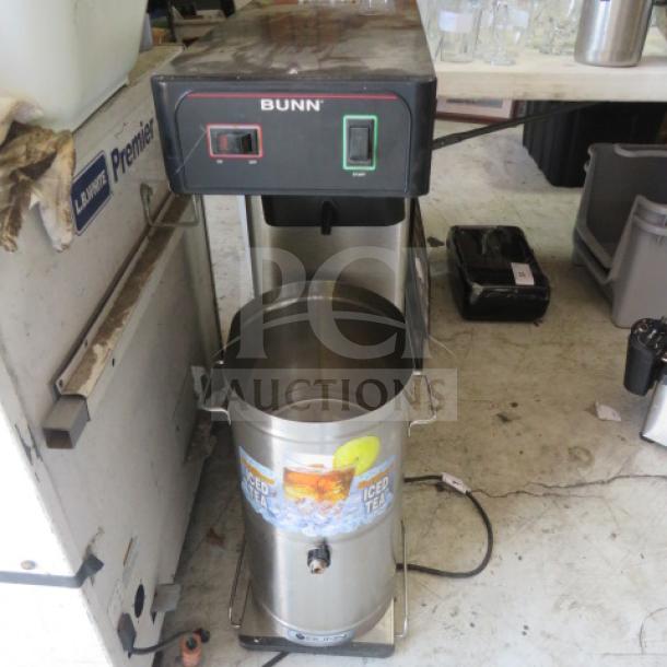Bunn Tea Brewer with Satellite, model 10X23X35, in used condition. Features stainless steel construction and control panel.