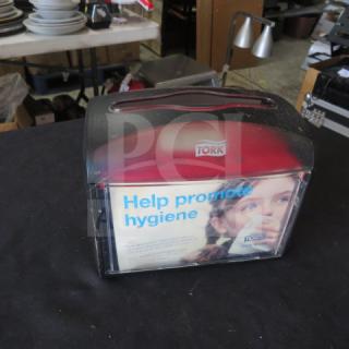 Tork Table Top Napkin Dispenser, red and black, with promotional hygiene message. Used condition, clear front panel.