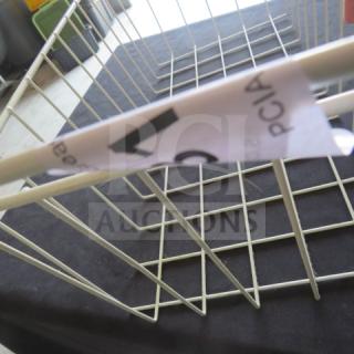 White wire basket, 11x23x10 inches. Features a visible tag with partial black text. Rectangular, lightweight, good condition.