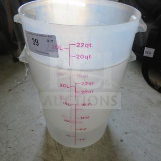 22-quart food storage container, marked with quart and liter measurements, clear plastic, used condition, auction tag visible.