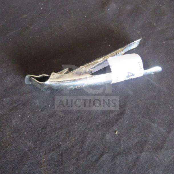 American Metalcraft SS Pan Grip, silver chrome finish, ergonomic design. Slight signs of wear, auction tag attached.