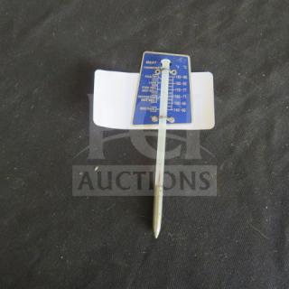 Metal meat thermometer with blue temperature guide, showing cooking levels for various meats. Good condition.