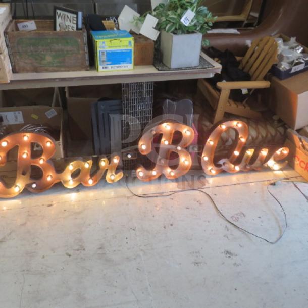 "Bar B Que" tin lighted sign, 84x17 inches, features vintage bulb design; good condition, ideal for décor or collection.