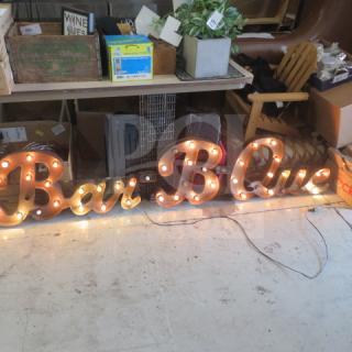 "Bar B Que" tin lighted sign, 84x17 inches, features vintage bulb design; good condition, ideal for décor or collection.