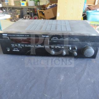 Yamaha stereo receiver, model RX-460, black finish, various control knobs, used condition with visible wear.