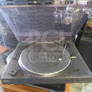 Sony turntable with clear dust cover, black finish, and tonearm. Used, showing some wear. Brand logo visible.