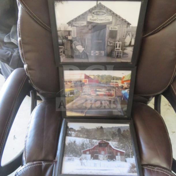 Three framed vintage-style decor photos on a chair, including vintage signs and a rustic barn, in good condition.
