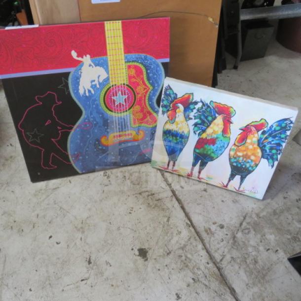 Assorted canvas pictures featuring a colorful guitar and vibrant roosters, in excellent condition.
