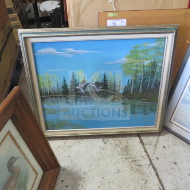 Framed landscape painting with ducks over a lake, surrounded by trees. Silver frame, good condition, auction tag visible.