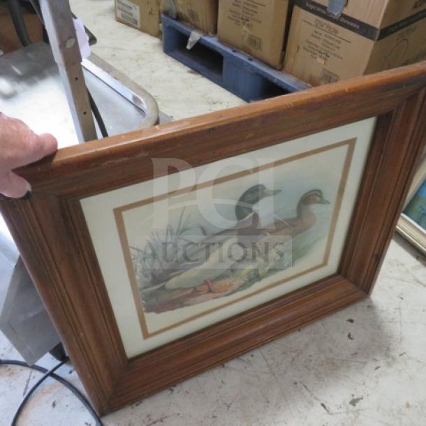 Framed picture of two ducks in nature, wood frame, glass cover, in good condition. Suitable for home decor.