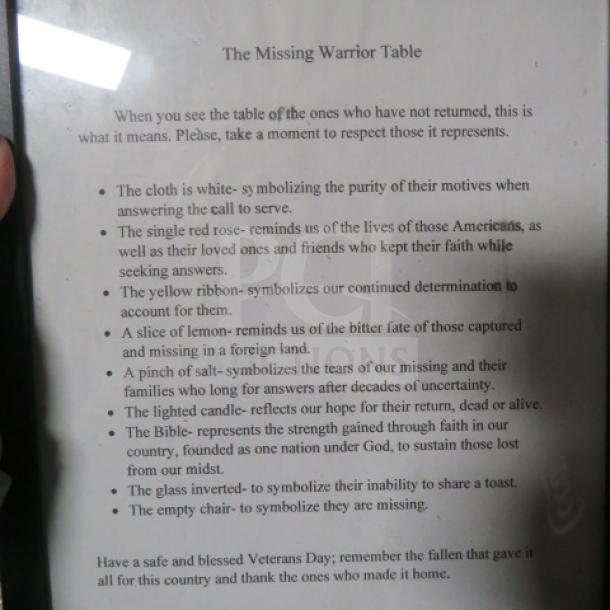 Framed "The Missing Warrior Table" explanatory text. Details symbolic items on table honoring veterans. Good condition.