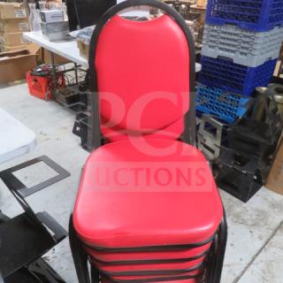 Black metal stack chair with red cushioned seat and back, shown in good condition, 4XBID model.