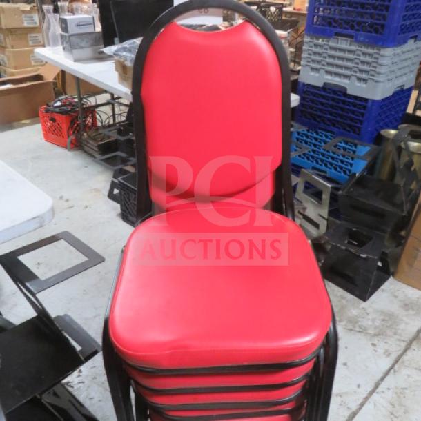 Black metal stack chair with red cushioned seat and back, in good condition. Multiple chairs shown stacked.