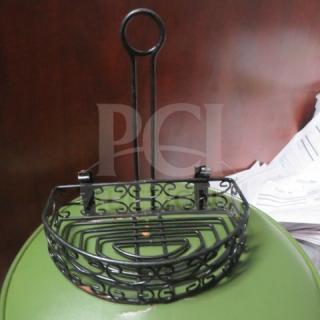 Black metal tabletop condiment holder with ornate design, featuring two compartments. Item in good condition. 10XBID marked.