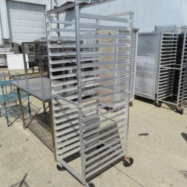One aluminum speed rack on casters, 21x26x69 inches, durable construction, suitable for commercial kitchen use.
