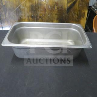 Stainless steel 1/3 size hotel pan, 4-inch deep, in good condition. Ideal for food service use.