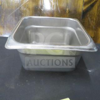 1/6 size, 4-inch deep stainless steel hotel pan in used condition, showing light wear. Ideal for food service.