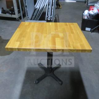 Butcher block table on pedestal base, 24x30x30 inches, wood top, metal base, excellent condition.
