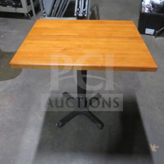 Butcher block table with pedestal base, 24x30x30 inches, wooden top, metal base, good condition.