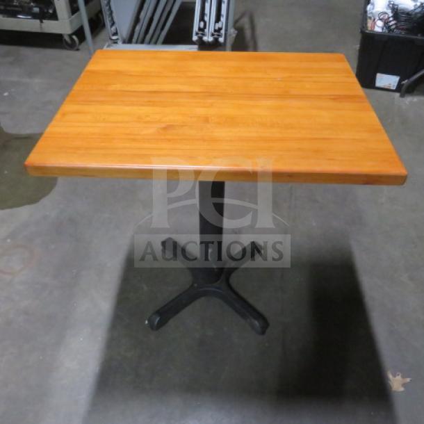 One butcher block table with pedestal base, 24x30x30 inches, wooden top, metal base, good condition.