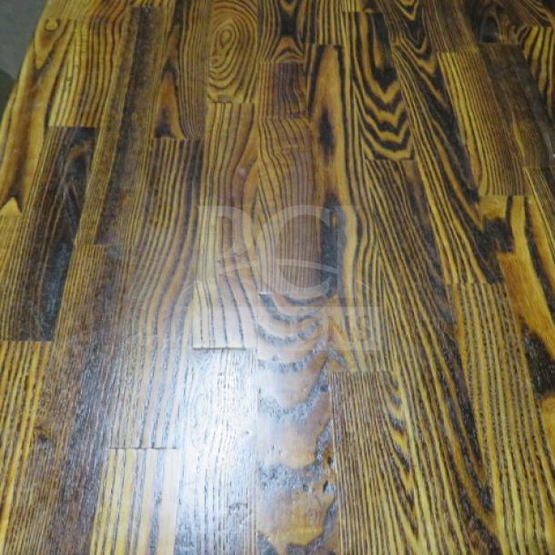 Butcher block table top with pedestal base, 24x24x30 inches, featuring rich wood grain pattern, in good condition.