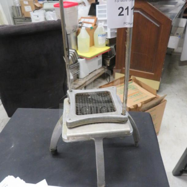 Nemco vegetable cutter with stainless steel frame and grid blade, in used condition, model tag shows item number 211.