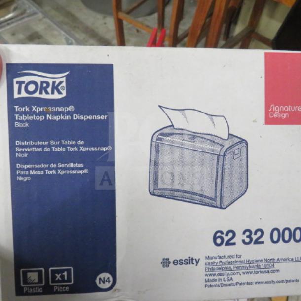 NEW Tork Xpressnap Napkin Dispenser in box. Model 62 32 000, black, tabletop design. Includes 1 piece. Made in USA.