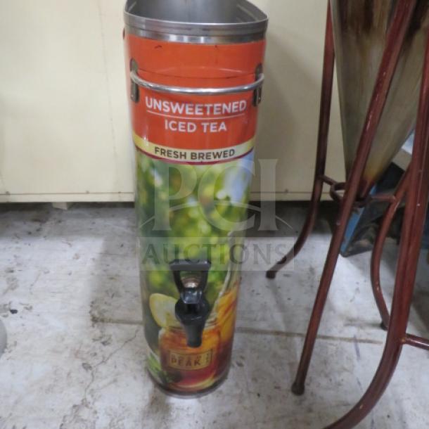 Tall stainless steel Slim Jim tea dispenser for unsweetened iced tea, featuring vibrant graphics and a pour spout.
