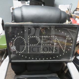 Open lighted sign, 21.5x13 inches, black frame, no plug, hangs with a chain. Good condition.