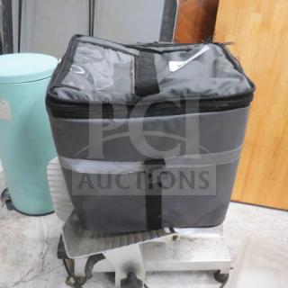 Winco insulated food carry bag in gray, zipper closure, good condition. Features carrying handles and reflective strip.