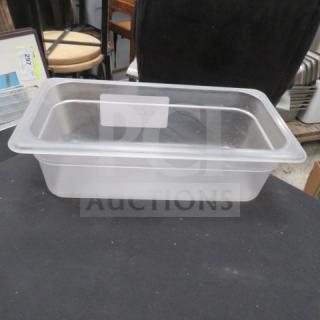 Clear one 1/3 size, 4-inch deep food storage container, in used condition. Transparent material with visible label space.