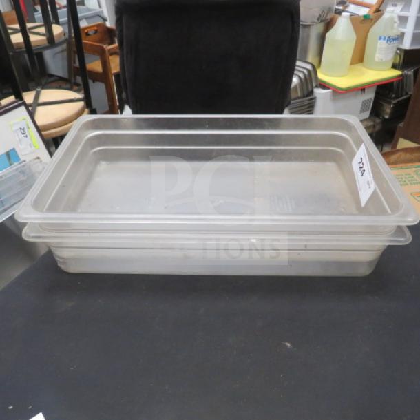 Full size 4-inch deep clear food storage container, stackable, good condition, 2XBID tag visible.