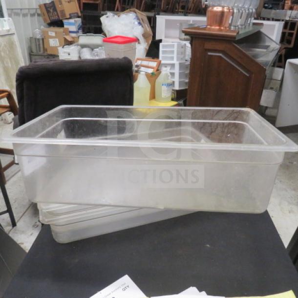 Clear full-size 6-inch deep food storage container, stackable, used condition, suitable for commercial kitchen use.
