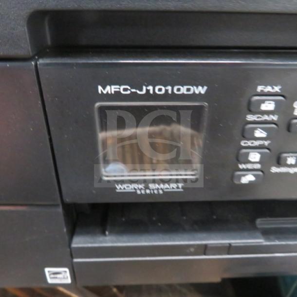 Brother MFC-J1010DW printer, Work Smart Series, with control panel and display. Features fax, scan, copy buttons.