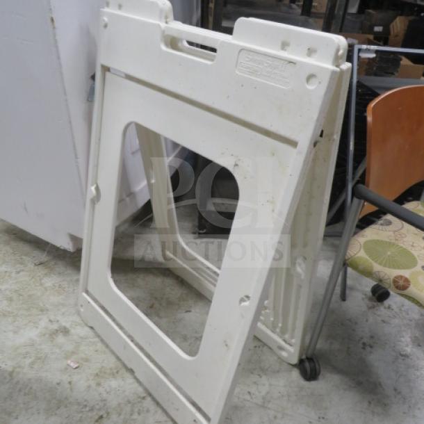 White Simpo Sign II sidewalk sign, foldable plastic frame, slightly worn condition, ideal for outdoor advertising.