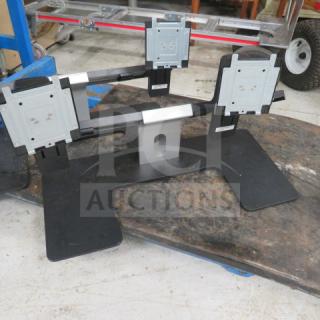 Dell Dual Monitor Holder 2XBID, supports two monitors, black and silver, adjustable arms, sturdy base, used condition.