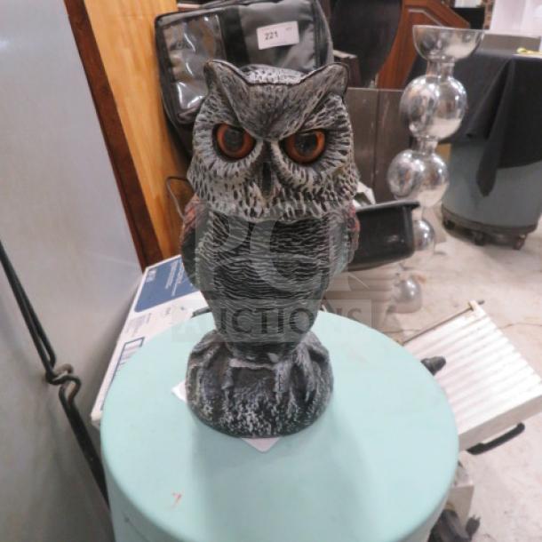 Decorative owl figurine with detailed carvings, featuring realistic feathers and striking orange eyes, in excellent condition.
